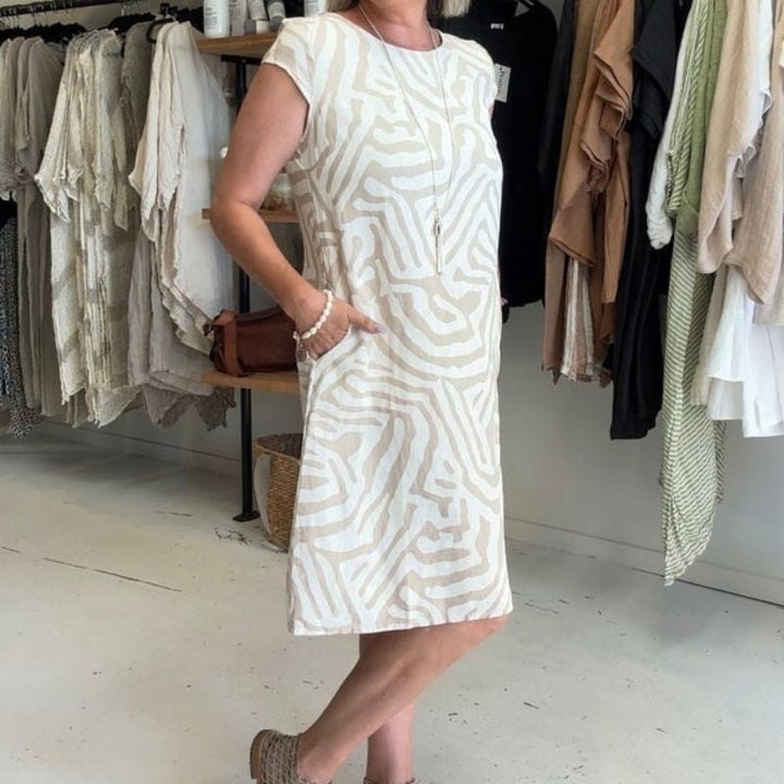 "Alie™ - Summer Dress with Round Neckline" could be rewritten as "Alie™ - Round Neck Summer Dress for the Perfect Look".
