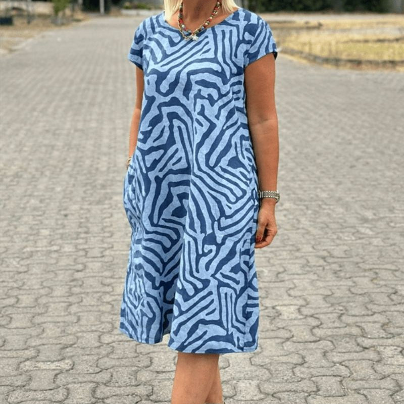 "Alie™ - Summer Dress with Round Neckline" could be rewritten as "Alie™ - Round Neck Summer Dress for the Perfect Look".