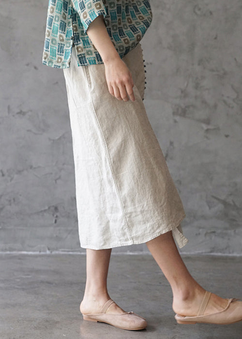 Feine beige elastische Taille asymmetrisches Taschendesign Leinenröcke Frühling